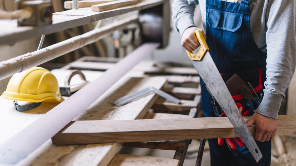 Man working with saw